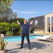 Darren showing off his new multi million pound property he won from a £10-a-month subscription to Omaze
