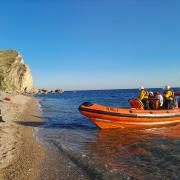 The lifeboat team arriving at St Oswalds beach