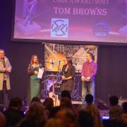 Tom Brown's accepting the award