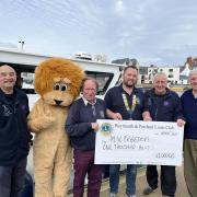Lions Ryan Hope, Kevin Brookes, Trevor Stratton, John Davies and volunteers from M.V. Freedom
