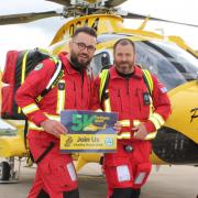 Air Ambulance crew encouraging people to sign up for the 5K Twilight Shift 2024