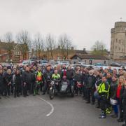Maiden Castle House resident Joe in the motorbike sidecar with more than 120 bikers