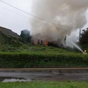 Fire crew remains on scene after barn fire