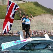 FLYING THE FLAG: Luke Patience and Stuart Bithell celebrate winning their silver medal in front of crowds beneath the Nothe