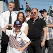 ALL ABOARD: Luke Joseph tours HMS Bulwark with Captain Alex Burton and foster parents John and Celia Arnell and foster brothers Jonathan Robinson and John McDonnell