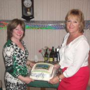 Mrs. Meryl Hodder and Mrs. Christine Wells with the anniversary cake