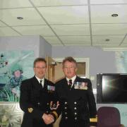GOODBYE: Peter Nash, left, receiving his VRSM medal from Commodore Jamie Miller