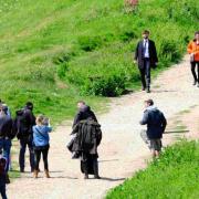BACK FOR MORE: David Tennant and Olivia Coleman filming a scene on the coast path on West Cliff