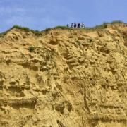 Film crew at the top of the cliff. Photo; Dorset Media Service