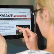 I SPY: A reader looking at the Swanage & Wareham Advertiser website on an iPad