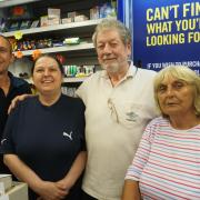EXIT TOYMAN: Mr Dobson (middle) says goodbye to his colleagues on his last day