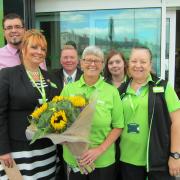 GOODBYE: Sandy West, middle, and staff from the Asda on Newstead Road, Weymouth