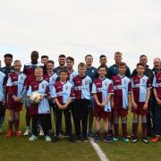 TOGETHER AS ONE: Players from the Weymouth youth set-up with the first-team before the club's 2-0 win over Chesham on Good Friday Picture: JAY CHARD