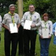 Mike Marsh (left) presents long service awards to Tony Fidler, Andrew Brewer, Sue Brown and Mary Brewer