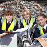 DISCOVERING MOUNTAINS OF RUBBISH: Students (from left) Chloe Watson, Jake Perrett and Emily Aves learn about Dorset’s recycling