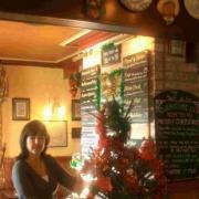 SPRUCING UP THE INN: Lorraine D’Agostino of the Riverhouse Inn with her ‘live’ Christmas tree