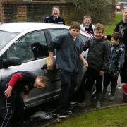 members of the Crossways youth forum wash their first car of the morning
