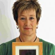 Rosemary Locock, with a treasured picture of Karina Glynn