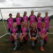 NEW KIT: Jurassic Coast Girls under-12s in their kit sponsored by McDonalds drive through Weymouth