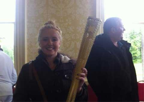 Dorset Echo reporter Emma Walker with the torch
