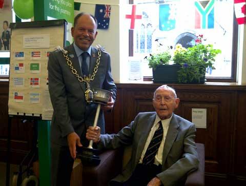1948 torchbearer Alf Barrett with Dorchester mayor Andy Canning 