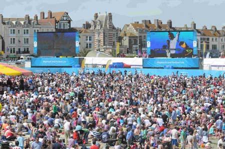 Our pictures of Olympic sailing events in Weymouth and Portland during London 2012. A packed-out crowd at the Live Site watch as Ben Ainslie sails to victory on Sunday, August 5. 