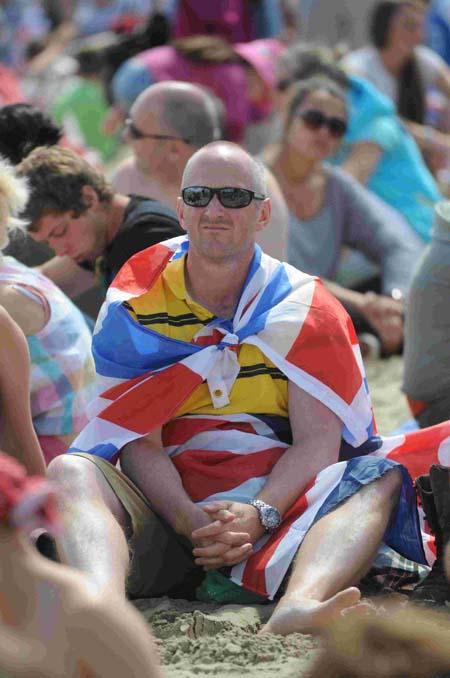 Our pictures of Olympic sailing events in Weymouth and Portland during London 2012. A supporter at the Live Site on Sunday, August 5. 