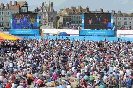 Our pictures of Olympic sailing events in Weymouth and Portland during London 2012. A packed-out crowd at the Live Site watch as Ben Ainslie sails to victory on Sunday, August 5. 