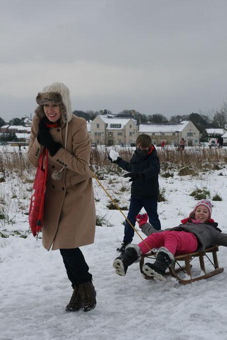 Snow 2013 around Dorset: Families playing in and around the Great Field in Poundbury. Photo by Echo reporter Miriam Phillips