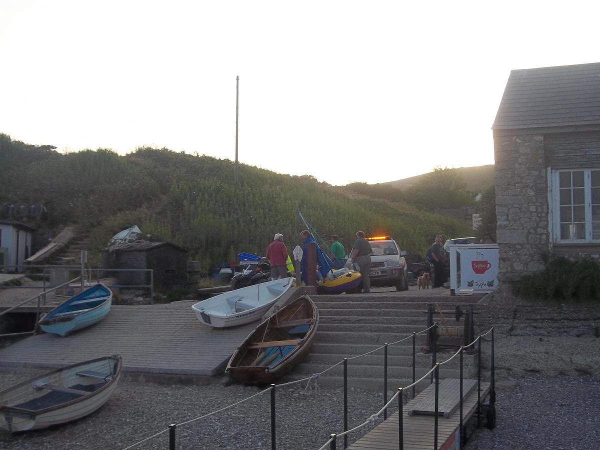 The man is returned to shore at Lulworth Cove, where he is met by paramedics, police and coastguards. PLEASE NOTE - PICTURES NOT AVAILABLE TO BUY