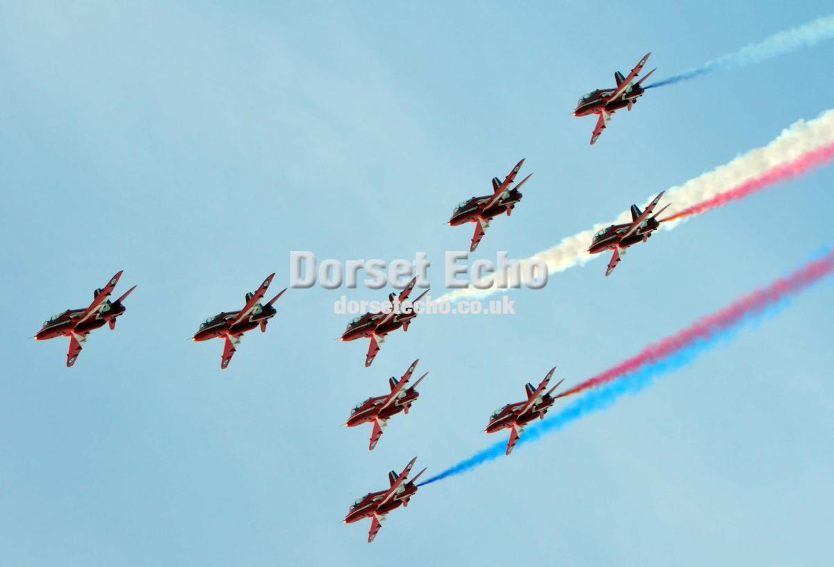 The Red Arrows swoop over Weymouth on carnival day