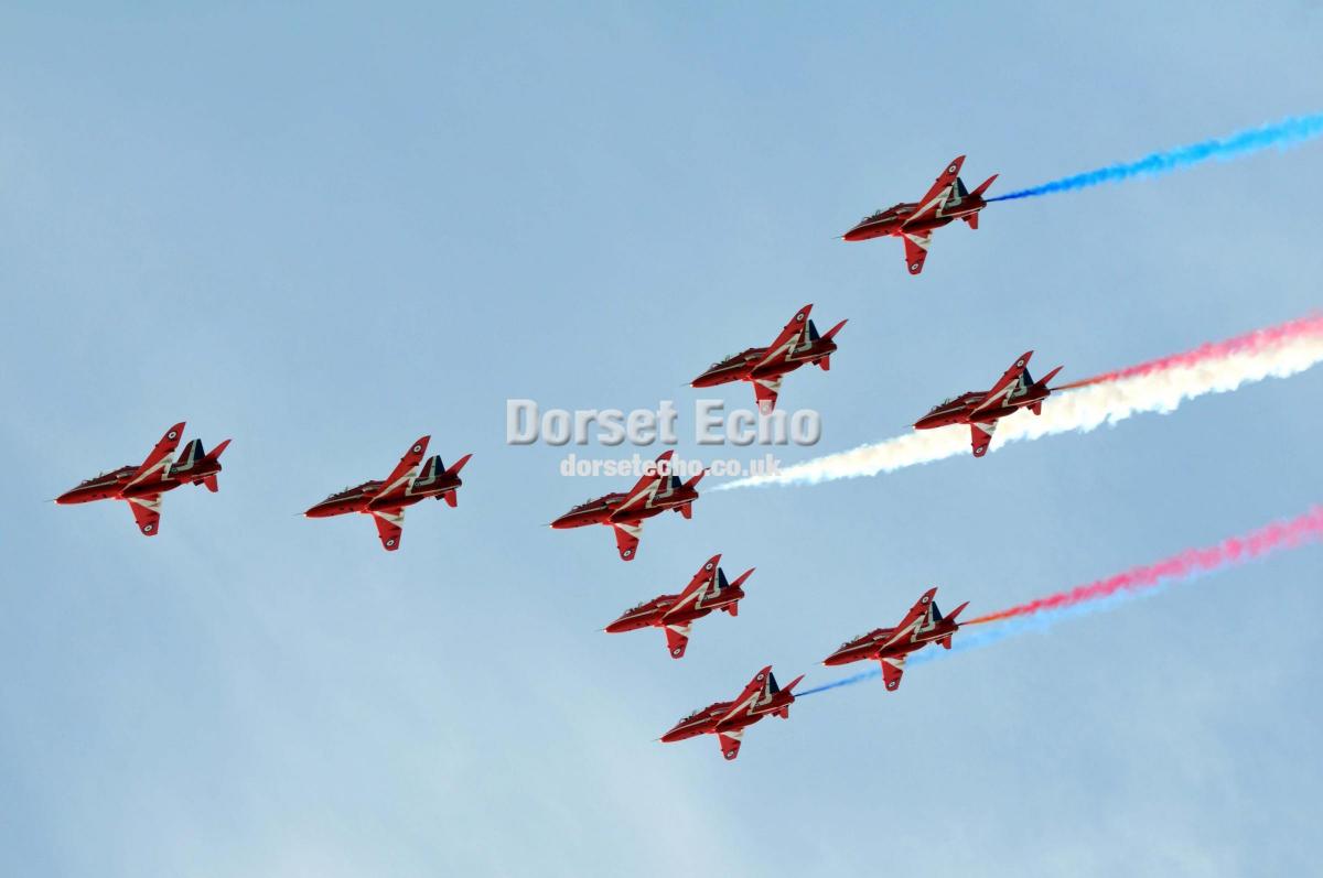 The Red Arrows swoop over Weymouth on carnival day