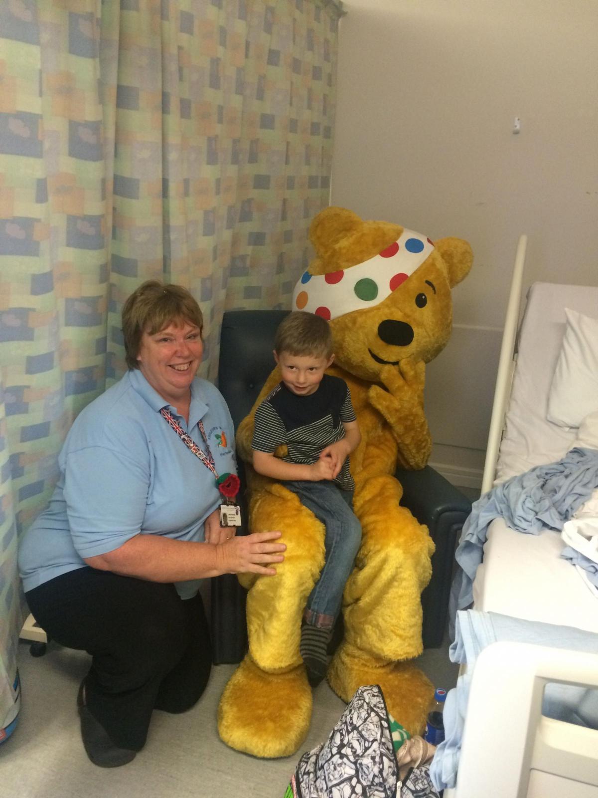 Pudsey with staff and a young patient at Dorset County Hospital