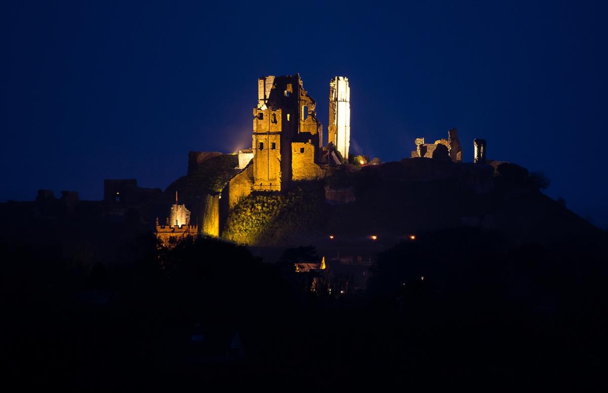 Corfe Castle illuminated by burning beacons last night. Picture by Gareth James