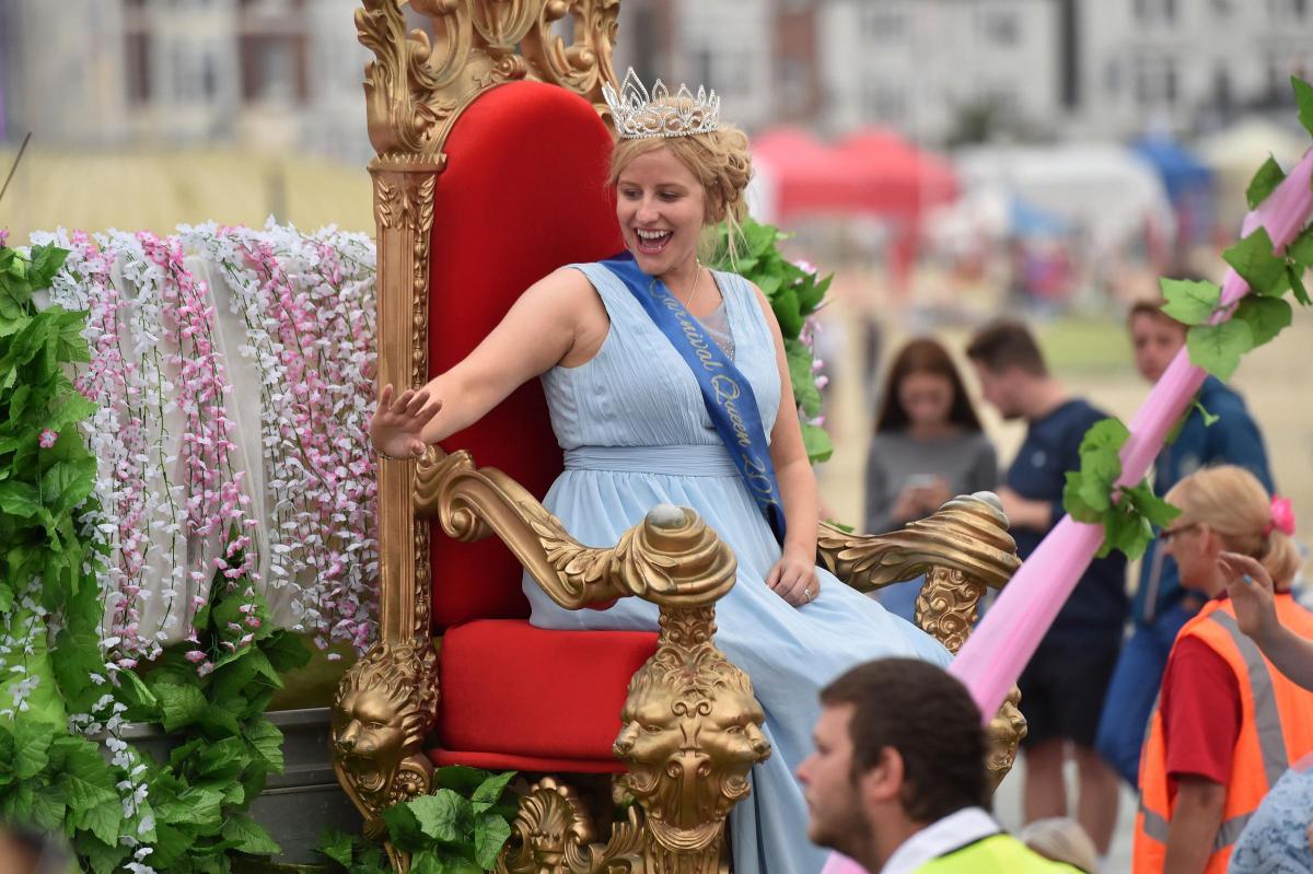 ALL HAIL: A regal wave from the carnival queen Claudia Moore