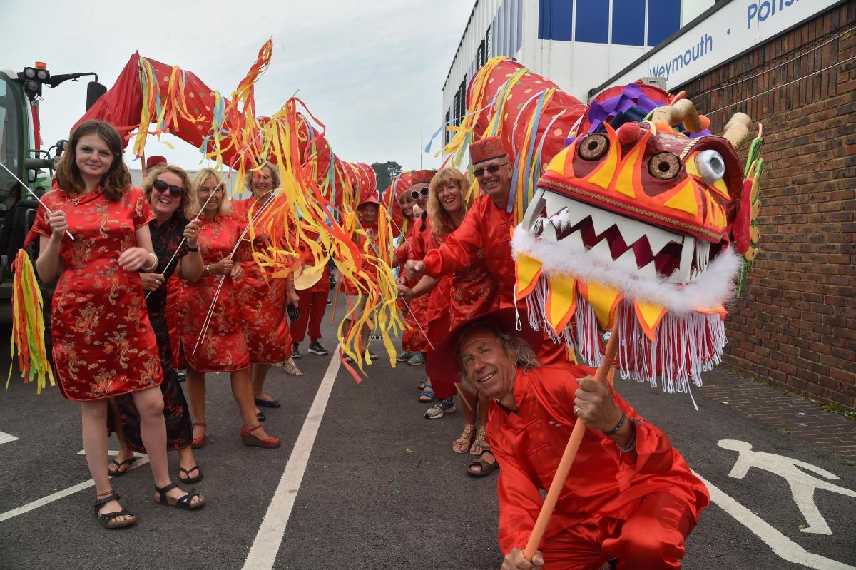 FIERCE: Hardy Hash House Harriers carry a dragon through the parade