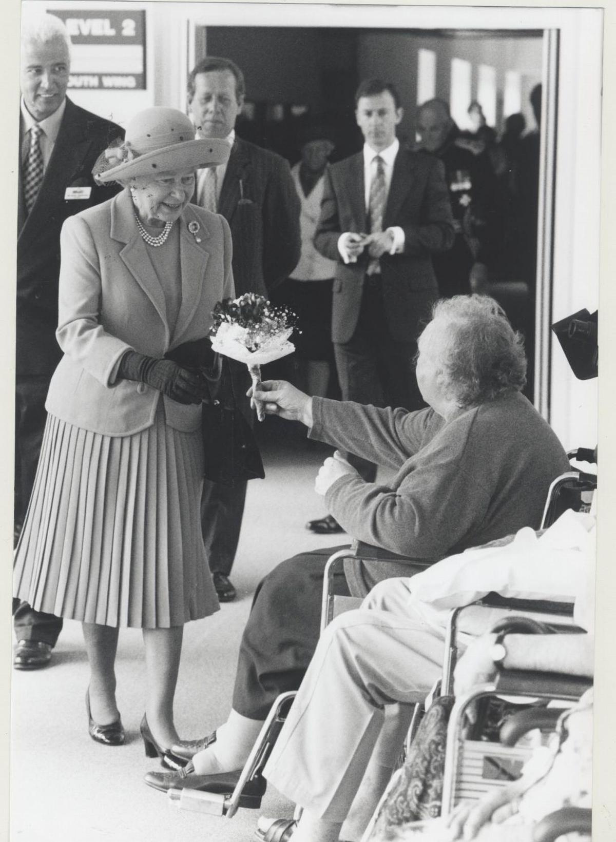The Queen recieves a posey from a patient at DCH on her visit in 1998
