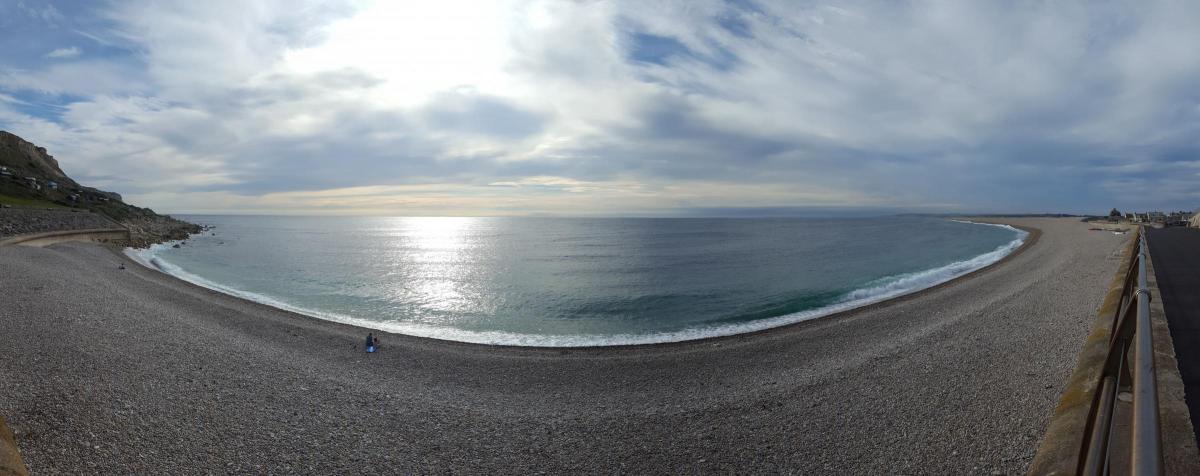 A calm Chesil Beach by James Buckley Photography