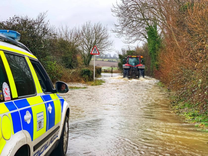Driver rescued by farmer as roads flood across Dorset 