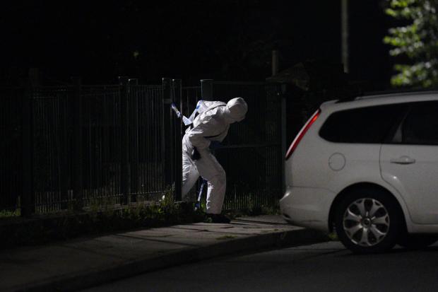 Dorset Echo: An officer in a forensics suit near the scene of an incident in the Keyham area of Plymouth. (pA)