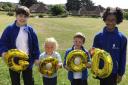 Youngsters at St Andrew's C of E Primary School in Weymouth celebrate the 'good' rating from SIAMS