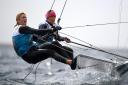 Charlotte Dobson and Saskia Tidey of Great Britain in action at the finish of a 49erFX class race. (Photo by Clive Mason/Getty Images).