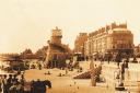 An old picture of Weymouth beach showing a helter skelter and a much lower sand level