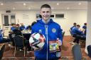 Joe Wickham with the match ball after his hat-trick for Portland United