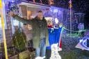 Martin Clunes switches on the Christmas lights at Bradpole home