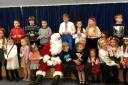 Cllr Hewitt with Father Christmas and Ukrainian children at the Dorford Centre last year