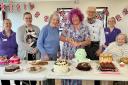 Carole (centre right) from Great British Bake Off with residents and the team at Fern Brook Lodge