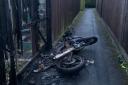 The motorbike was on fire down an alleyway close to homes