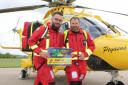 Air Ambulance crew encouraging people to sign up for the 5K Twilight Shift 2024