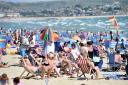 Holiday makers on Weymouth beach, basking in the mid August summer sunshine. Picture:JOHN GURD